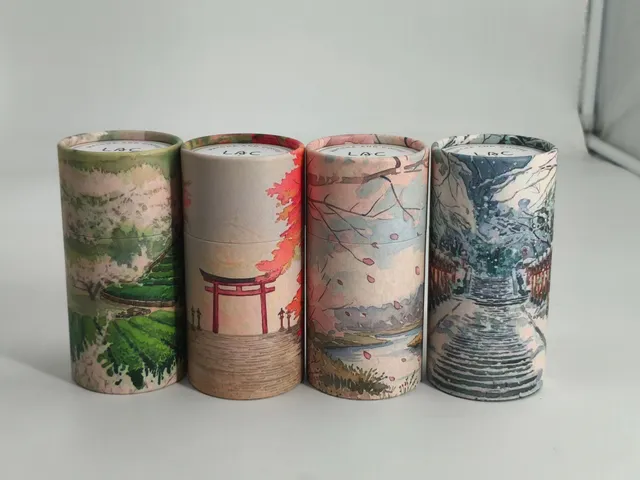 Four hand-illustrated Lạc canisters lined up, each with its own seasonal watercolor scene — tea fields, a torii gate, cherry blossoms, and snow