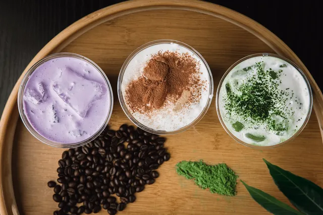 Overhead view of ube, Vietnamese coffee, and matcha drinks from Lạc Coffee